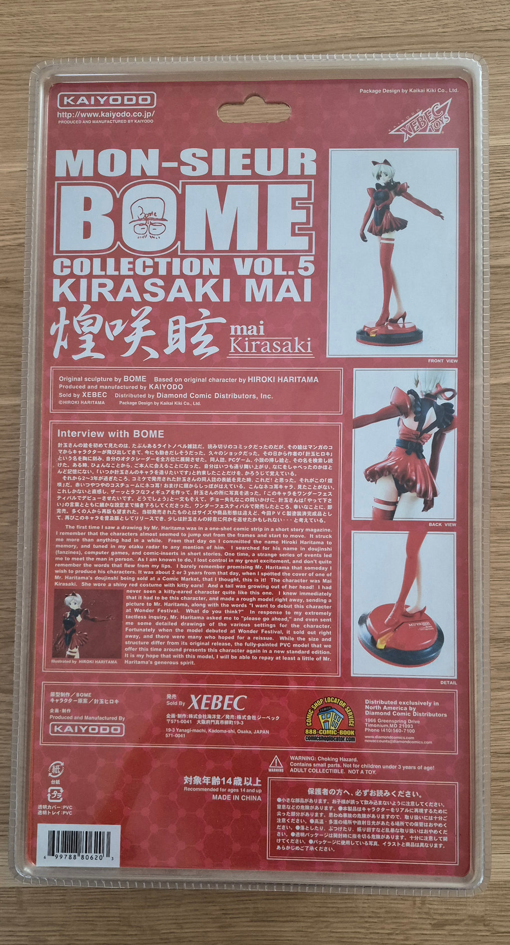 Mon-Sieur Bome Collection Vol. 5 Kirasaki Mai figure by Kaiodo, shown in its original red and white blister packaging on a light wood surface.